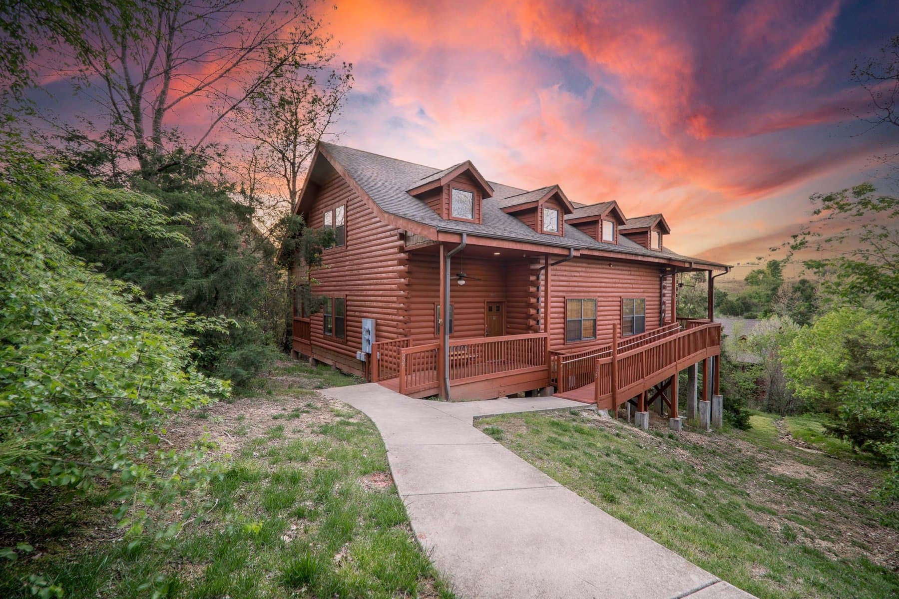 Thousand Hills lodge at sunset with dramatic pink sky